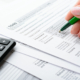 Female Hands And Tax Form